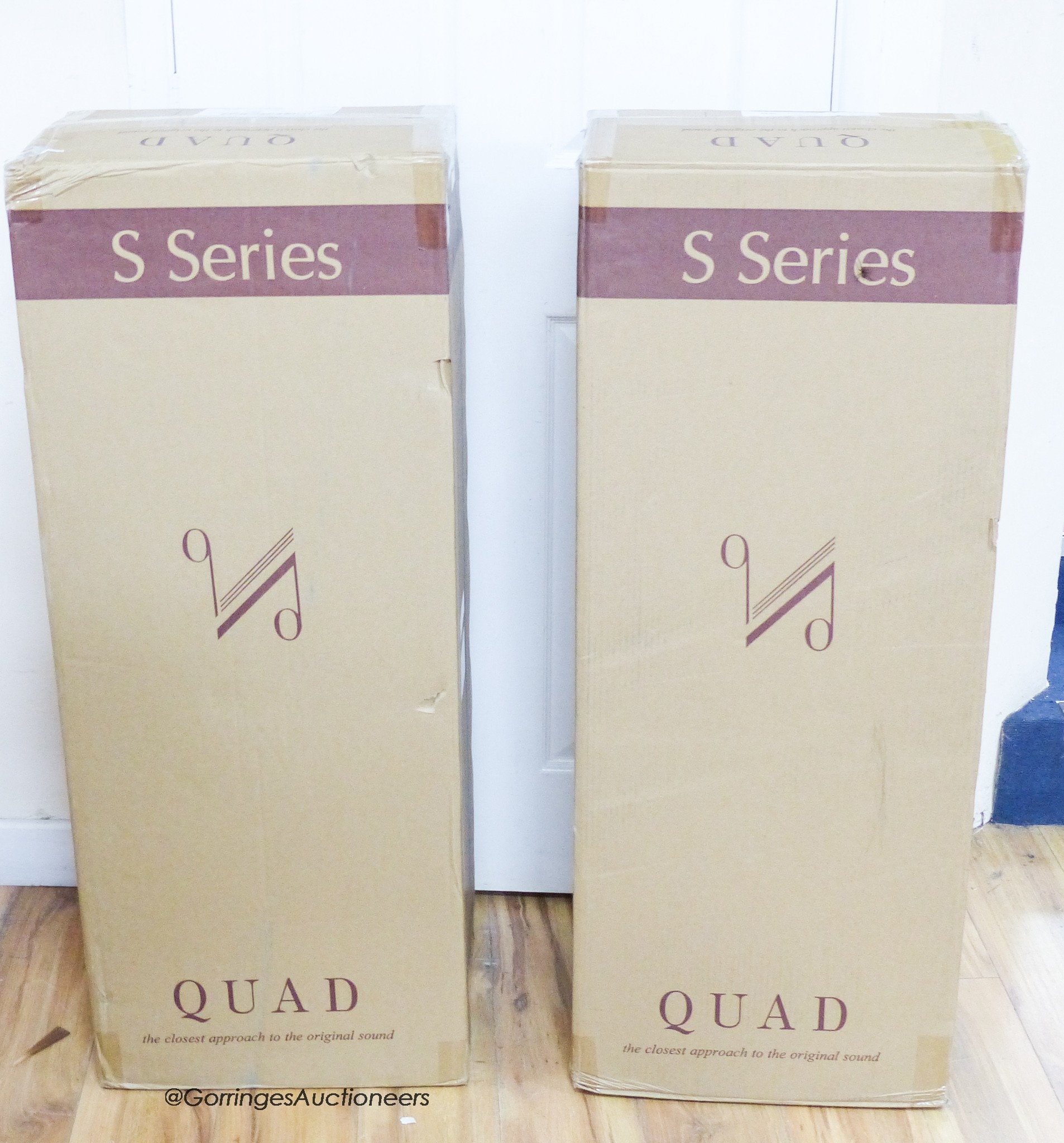 A pair of boxed Quad S Series speakers
